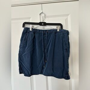 Blue canvas skirt. Mid-thigh length. Size 12 fits like a Medium